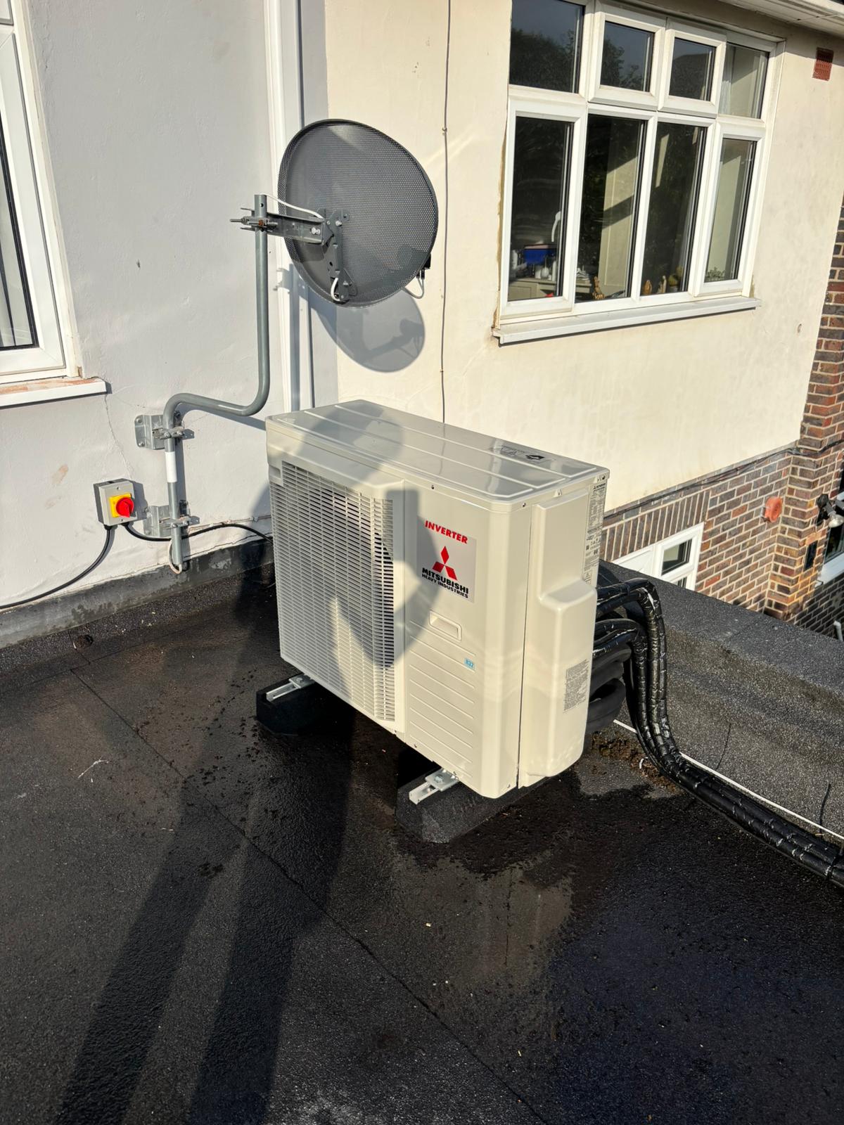 Multi-split outdoor air conditioning unit installed on a flat roof in Worcester Park